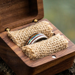 Maris tungsten ring with koa wood and abalone shell inlay in a ring box by Natural Rings