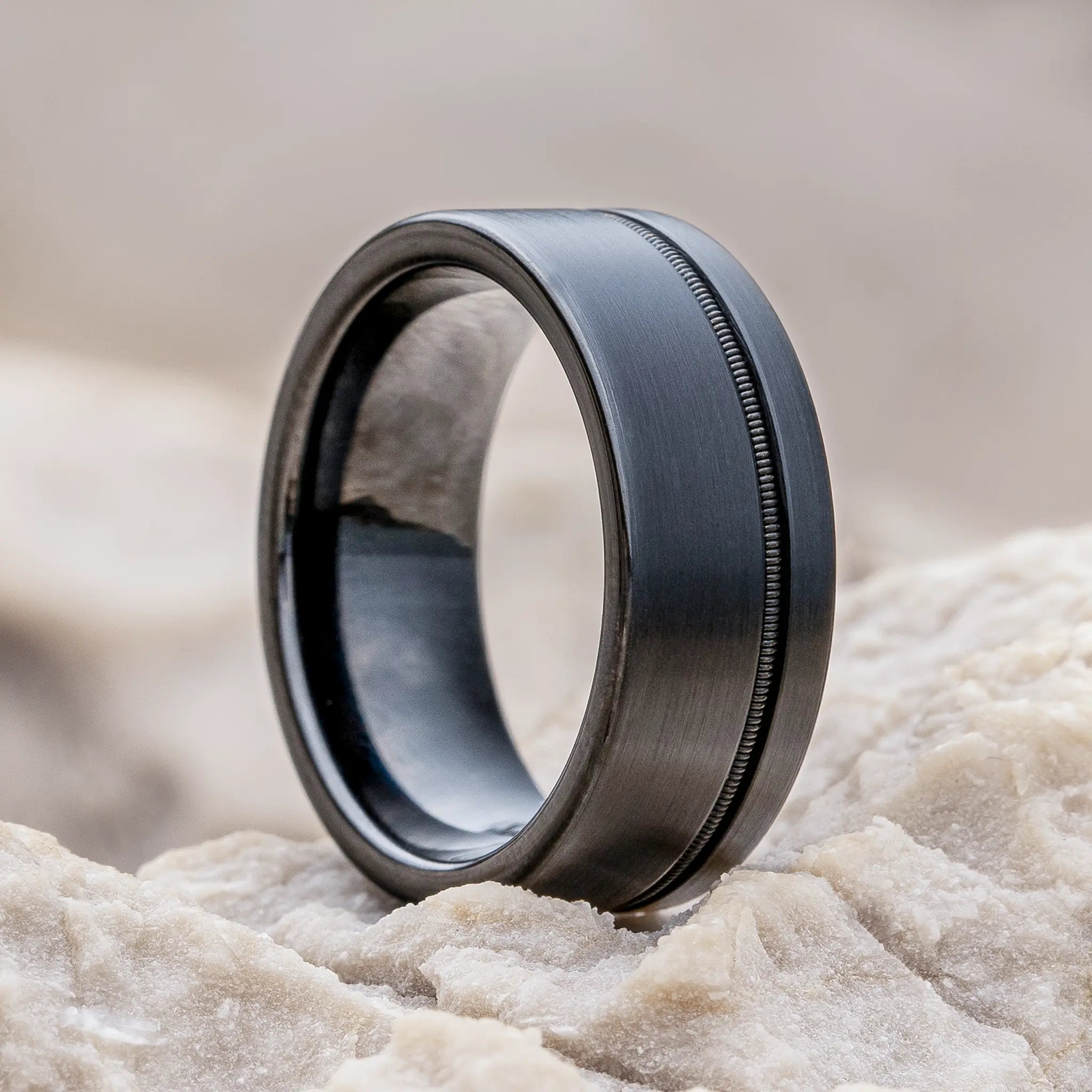 Solus black tungsten ring with guitar string by Natural Rings