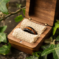 Umbran black tungsten ring with koa wood inlay in a ring box by Natural Rings