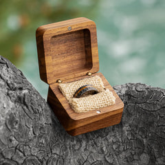 Vulcan black tungsten ring with whiskey barrel wood inlay in a ring box by Natural Rings